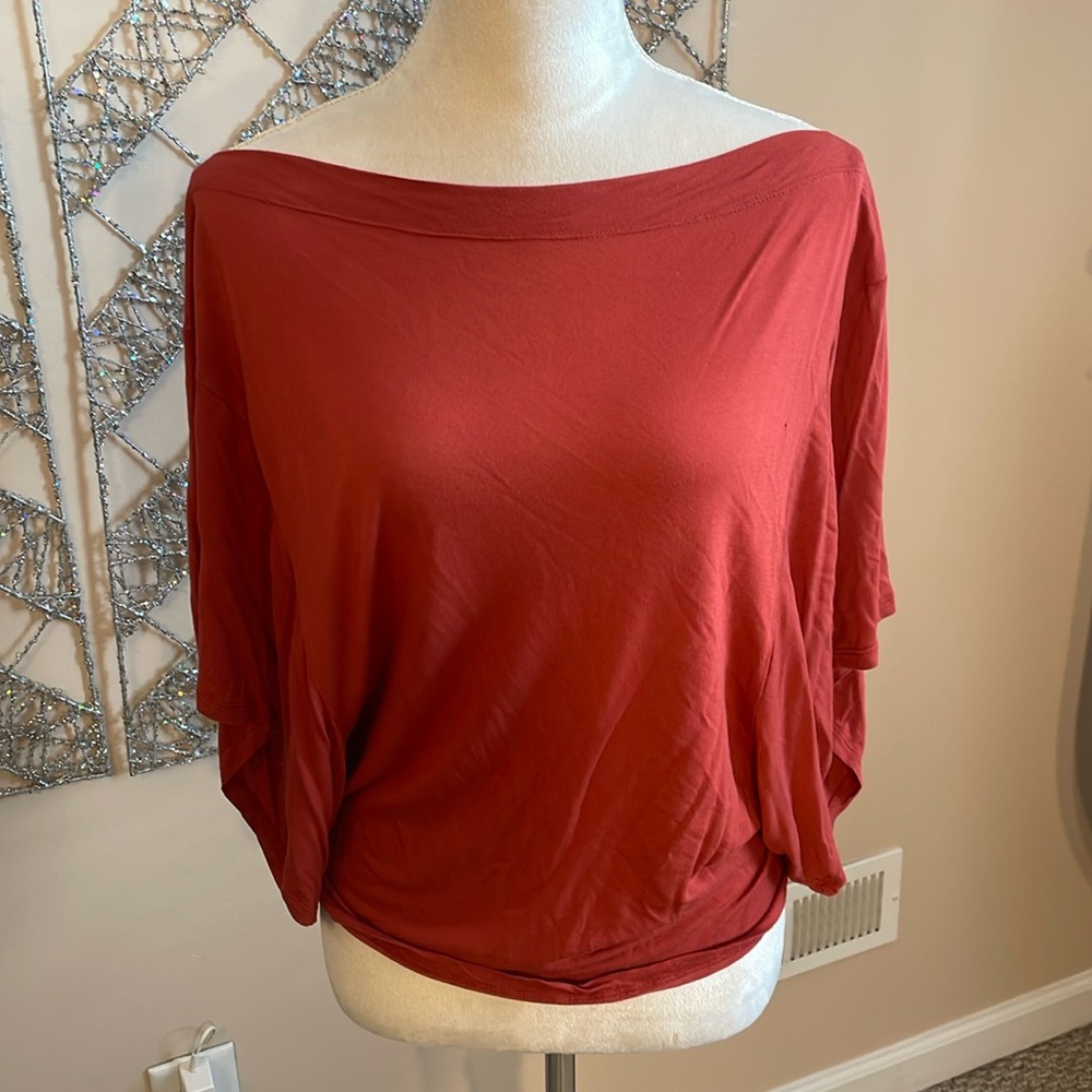 Bebe rust colored boat neck top size M/L